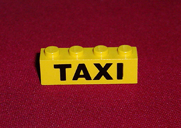 LEGO 3010p45 Brick 1 x 4 with Black 'TAXI' Pattern - Main Product Image