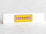 LEGO 2431pb0304 Tile 1 x 4 with Dark Red Heart and Medium Lavender '3186 BSS' on Yellow Background Pattern (Sticker) - Set 3186 - Main Product Image