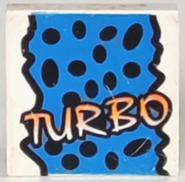 LEGO 3068px22 Tile 2 x 2 with Yellow &#39;TURBO&#39;, Black Spots, Blue Background Pattern - Main Product Image