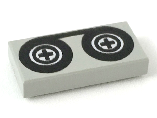 LEGO 3069p02 Tile 1 x 2 with Black Tape Reels Pattern - Main Product Image