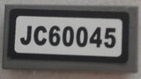 LEGO 3069pb0582 Tile 1 x 2 with Black &#39;JC60045&#39; Pattern (Sticker) - Set 60045 - Main Product Image
