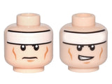 LEGO 3626pb0637 Minifigure, Head Dual Sided White Headband, Medium Nougat Cheek Lines and Chin Dimple, Frown / Lopsided Open Mouth with Teeth Pattern - Main Product Image