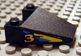 LEGO 4858pb06 Wedge 4 x 4 Taper without Stud Notches with Blue & Yellow Splash & &#39;3&#39; Pattern on Both Sides (Stickers) - Set 8207 - Main Product Image