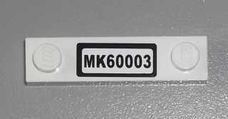 LEGO 92593pb011 Plate, Modified 1 x 4 with 2 Studs without Groove with &#39;MK60003&#39; Pattern (Sticker) - Set 60003 - Main Product Image
