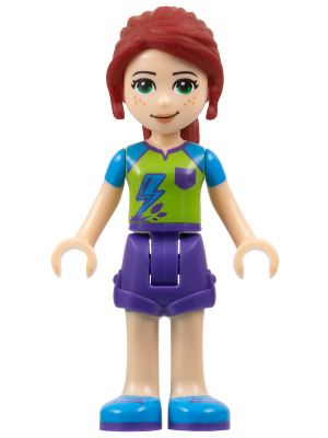LEGO Friends Mia minifigure with dark red hair, green eyes, lime shirt with blue lightning, dark purple shorts, and blue shoes.