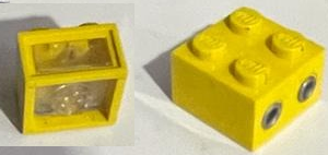 Yellow LEGO Electric Light Brick 12V 2x2 with trans-clear lens, showing studs and two plug holes.