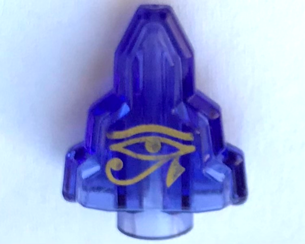 Translucent blue LEGO Rock 1x2 Crystal Stepped with gold Egyptian Eye of Horus Moonstone pattern.