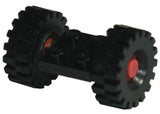 Black LEGO 2x2 modified plate with red axles and two black wheels with medium offset tread tires.