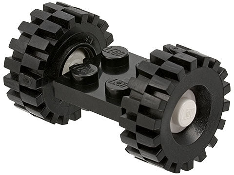 Black LEGO 2x2 modified plate assembly with two black 21mm D. x 9mm offset tread tires and white wheel hubs.