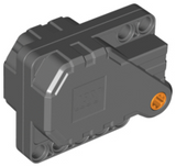 Dark gray LEGO 12787c01 Pullback Motor 6 x 5 x 3, an angular block with an orange axle on one end.