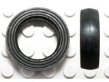 Small solid black LEGO tire (132old) with a smooth tread, shown from the top and side views on a white studded base.