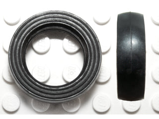 Small solid black LEGO tire (132old) with a smooth tread, shown from the top and side views on a white studded base.