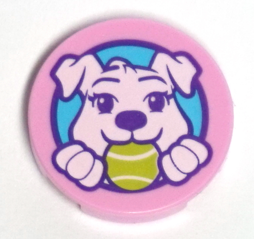 Pink round LEGO tile with a white puppy dog holding a green ball in its mouth, set against a light blue background.
