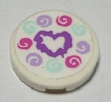 A round white LEGO 2x2 tile with a medium lavender heart and dark pink, light aqua, and lavender swirls.