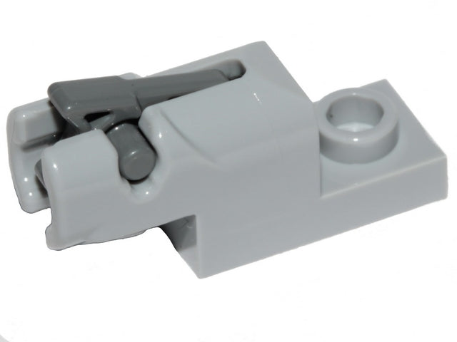 Light gray LEGO 1x2 mini blaster/shooter with a dark bluish gray trigger mechanism, viewed from the side.