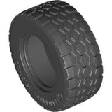 Black LEGO tire, part 15413, with a distinct hexagonal tread pattern and dimensions 49.5 x 20, shown at an angle.