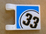 White LEGO 2x2 flag piece with a blue background and a black '33' inside a white circle sticker.