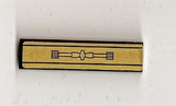 LEGO Tile 1x4 with gold panel pattern sticker, featuring a black central design of a linked bar with end gears.