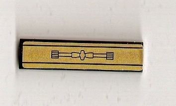 LEGO Tile 1x4 with gold panel pattern sticker, featuring a black central design of a linked bar with end gears.