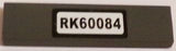 LEGO dark gray 1x4 tile with 'RK60084' pattern sticker.