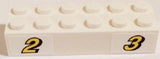 White LEGO Brick 2 x 6 with Yellow Number 2 and 3 with Black Outline Pattern.