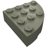 A dark gray LEGO 2577 Round Corner 4 x 4 Full Brick with twelve studs on its curved top surface.