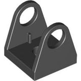 Dark gray LEGO 2584 String Reel 2 x 2 Holder, a square base with two triangular sides featuring large holes.
