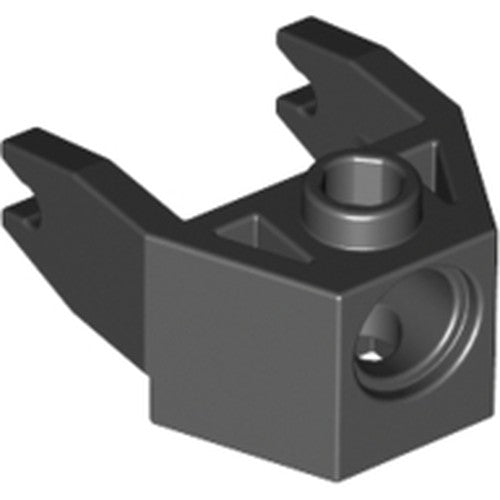 Black LEGO 2607 part, a 2x3 magnet holder with two clips and a pin hole on top, and a magnet hole on the side.