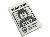 White LEGO 2x3 tile with 'WANTED!' and dark bluish gray minifigure mugshot with '604-15' pattern.
