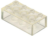 Close-up of a transparent clear LEGO 2x4 brick without cross supports, showing 8 round studs on top.