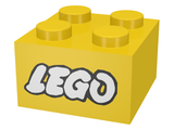 A yellow 2x2 LEGO brick with four studs on top, featuring the white LEGO logo with a black outline on its side.