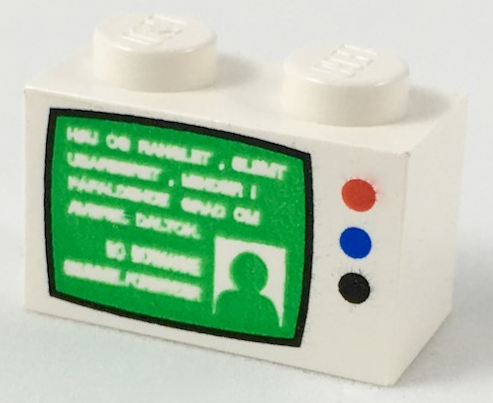 White LEGO 1x2 brick with green TV screen pattern, white text, person silhouette, and red, blue, black buttons.