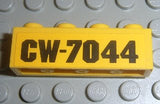 Yellow LEGO 1x4 brick with black 'CW-7044' pattern, part of Set 7044.