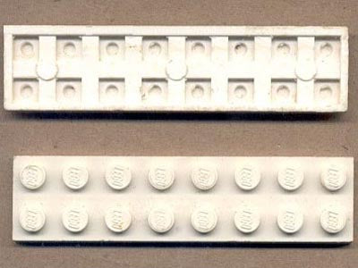 Underside and top view of a white LEGO 2x8 plate. The bottom has a waffle pattern and 'Patent Pending' circles.