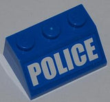 A blue LEGO slope brick, 2x3, with three studs, featuring 'POLICE' in bold white letters on the front surface.