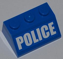 A blue LEGO slope brick, 2x3, with three studs, featuring 'POLICE' in bold white letters on the front surface.