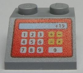 Grey LEGO 2x2 slope brick with a red cash register pattern displaying numbers, operations, and '+15'.