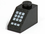 Black LEGO 3040p33 Slope 45 2 x 1 brick with a textured surface and a white keypad pattern on the sloped face.