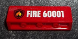 Red LEGO 1x4x1 panel with a flame on black shield logo and white text 'FIRE 60001' pattern.