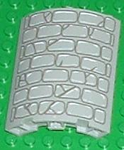 Light gray LEGO cylinder quarter 4x4x6 brick with dark gray stone wall pattern print on a green background.