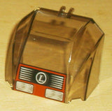 Trans-brown LEGO 30633pb05 windscreen 4x6x4 canopy with hinge, featuring headlights, grille, and 'L' circle pattern.