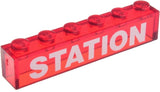 Red transparent LEGO 1x6 brick with white 'STATION' text and 6 studs on top.