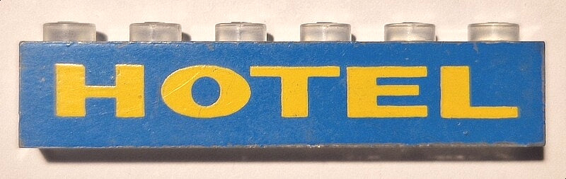 LEGO 3067pb10 blue 1x6 brick with yellow 'HOTEL' print and clear studs.