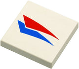 White LEGO Tile 2 x 2 featuring a red and blue windsurfer triangles pattern.