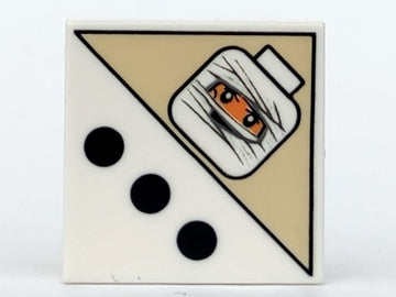 White LEGO 2x2 tile with 3 black dots and a tan area featuring a mummy head pattern with orange eyes and white bandages.