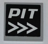 A light gray LEGO 2x2 tile featuring a black pattern with white 'PIT' text and three right-pointing arrows.