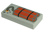 Light grey LEGO 1x2 tile with a printed dynamite pattern, showing red sticks, black bands, and a lit fuse with a spark.