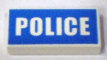 LEGO 3069pb0139 Tile 1x2 with 'POLICE' in white on a blue rectangular background.