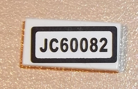 LEGO 3069pb0687 Tile 1 x 2 with 'JC60082' pattern (sticker) from Set 60082