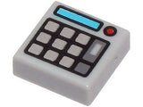 White LEGO 1x1 tile with silver keypad buttons, medium azure screen, and red light pattern, resembling a calculator.